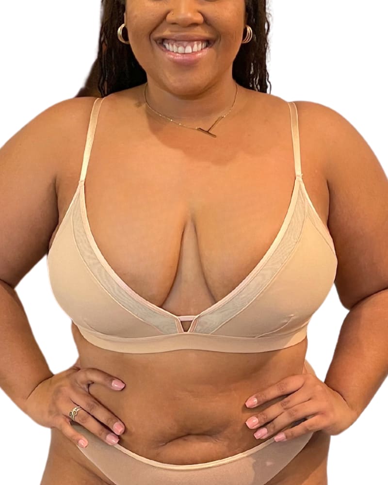 Front of a model wearing a size X-Large Nude Shade Full Coverage Bralette in Honey by Naked Rebellion. | dia_product_style_image_id:327966